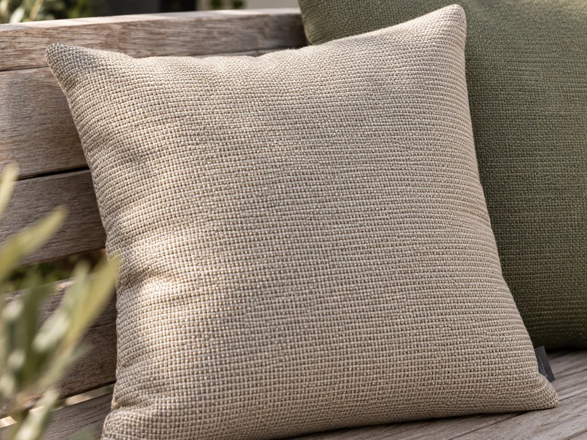 Close-up of Sunbrella cushions on a garden bench